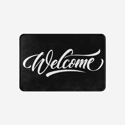 Zwarte deurmat met 'Welcome' opdruk