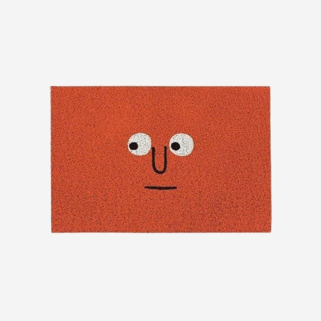 Grappige rode deurmat met gezicht