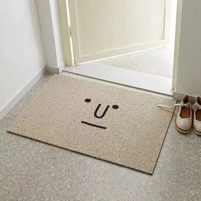 Originele grijze deurmat met gezicht