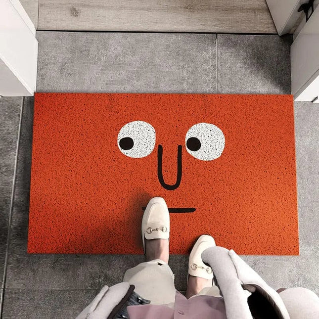 Grappige rode deurmat met gezicht