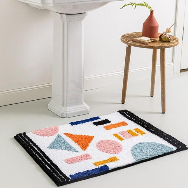 Witte absorberende badmat met vormen