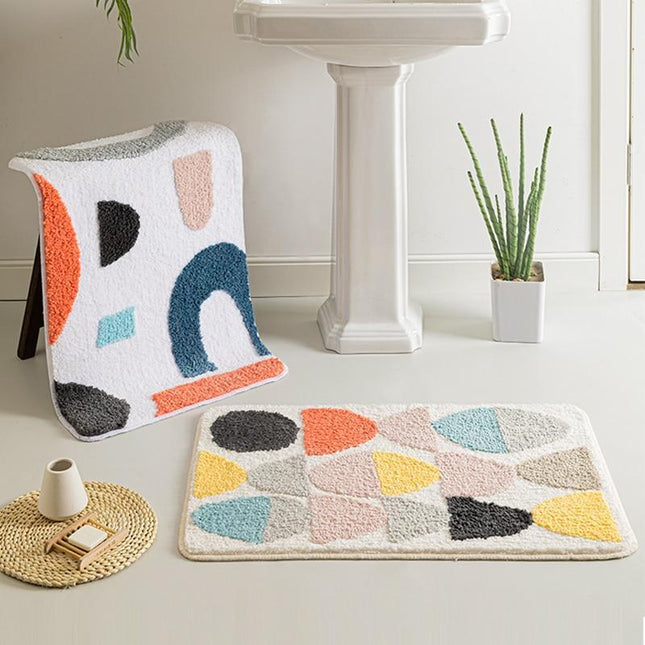 Witte antislip badmat met kleurrijke vormen
