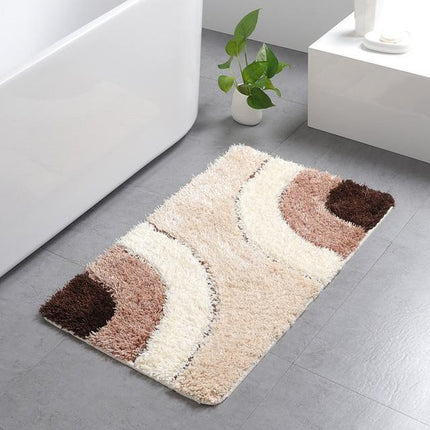 Beige en bruine badmat met golven