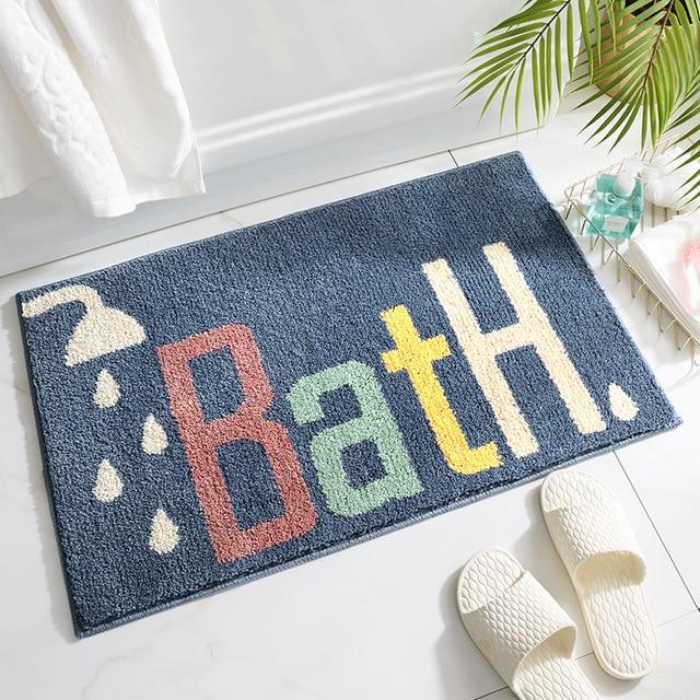 Koningsblauwe badmat met tekst 'Bath'