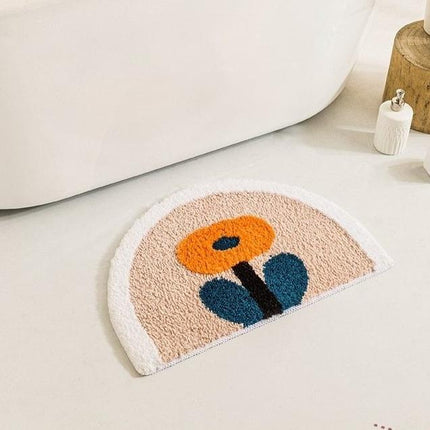 Halfronde badmat met oranje bloem