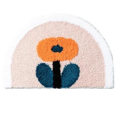Halfronde badmat met oranje bloem
