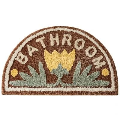 Gele halfronde badmat met bloemen