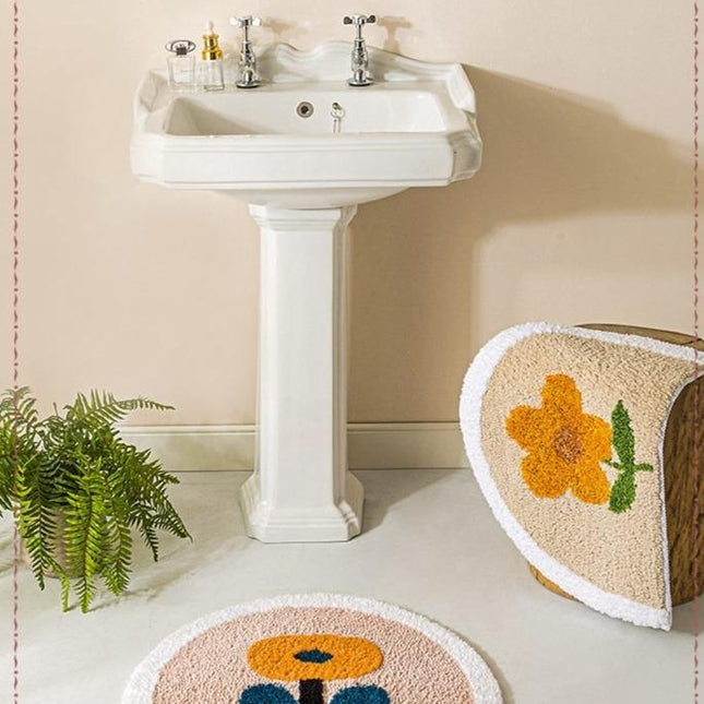 Badmat met gele bloem en blaadjes