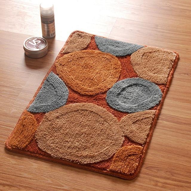 Bruine badmat met ronde stenen design