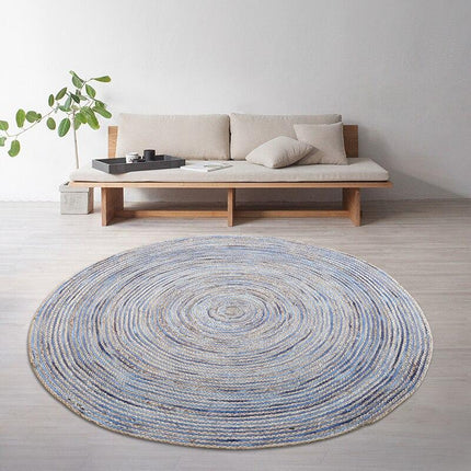 Rond blauw vloerkleed van jute
