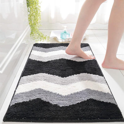Zwart witte badmat met golfpatroon