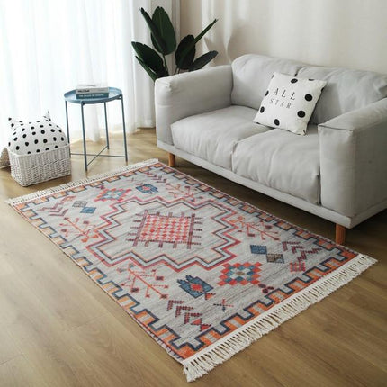 Woonkamer vloerkleed oranje en grijs