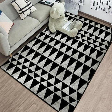 Zwart vinyl vloerkleed met driehoeken